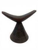 An early 20th century Ethiopian tribal carved hardwood Kambatta neck or headrest. H.17 W.18cm.