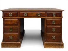 A 19th century mahogany twin-pedestal desk with brown leather lined top over an arrangement of