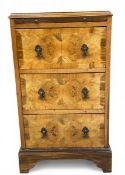 A small mid century Georgian style walnut bachelor's chest with quarter-veneered and crossbanded top