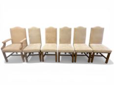 A set of six contemporary dining chairs each with a faux suede upholstered back and seat raised on