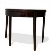 A Georgian mahogany demi lune tea table table with circular, figured, foldover top raised on