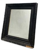 A 19th century wall mirror with square plate in a black painted foliate frame. H.91 W.77 D.9cm