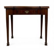 A Georgian mahogany tea or occasional table with breakfront fold-over top over the single frieze