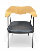 A contemporary 675 armchair with shaped, bentwood back over the black leather seat raised on splayed