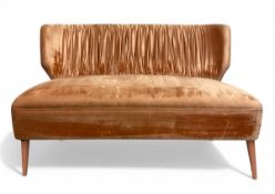A contemporary Portuguese 'Lipstick' two-seater sofa with shaped and pleated back over the salmon