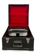 A Chamoon piano accordian in fitted hard carrying case. H.25 W.45 D.47cm