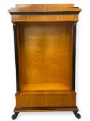A vintage Spanish Biedermeier-style satinwood birch bookshelf with pitched pediment over the