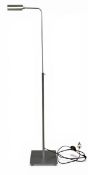 A contemporary adjustable brushed metal Ouadi reading floor lamp with rotating reflector shade by
