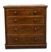 A 19th century mahogany chest of two short over three long graduating drawers raised on a shaped