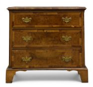 A 19th century Georgian style burr walnut chest of three crossbanded and satinwood strung drawers