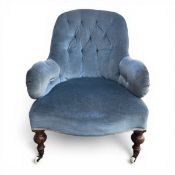 A Victorian slipper or nursing chair with blue velour upholstered button-back and shaped arms over