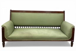 A mid 19th century carved mahogany sofa having a square back with spindle detail over the shaped