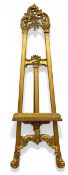 A carved giltwood artist's easel with Rococo cresting. H.160 W.51cm