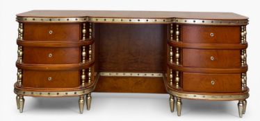 A modern 19th century Italian style walnut dressing table or desk with shaped top over the gilt