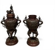 A pair of early 20th century Japanese brass Koro censers with foo dog finials and stylised dragon