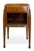 A walnut side table or bedside cabinet in the French Art Deco style with gilt and tooled green