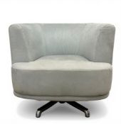 A contemporary duck egg faux suede upholstered swivel tub armchair raised on a splayed metal base.