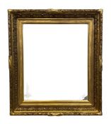 A 19th century gilt gesso picture frame with scrolling foliate border in a laurel leaf and berry