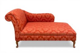 A contemporary chaise longue with scrolled back and shaped arm over the damask upholstered seat