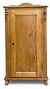 A 19th century Scandinavian pine pier or side cabinet with panel door enclosing shelved interior.