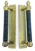 A pair of large Victorian James Cartland & Sons black lacquered brass door handle pulls with