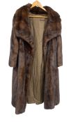 A vintage Harrods ladies mahogany mink fur coat with maker's mark. Medium size.