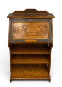 An early to mid 20th century Arts & Crafts style pyrographed walnut bureau having an angular gallery