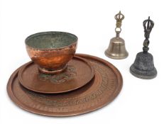 A 19th century Middle Eastern hammered and engraved copper bowl together with two similar trays
