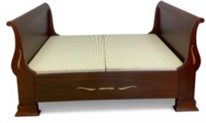 A contemporary brass mounted 19th century Continental style mahogany sleigh bed with scrolled head