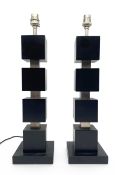 A pair of contemporary black lacquered and nickel plated table lamps. H.49cm each