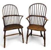 Two late 18th or early 19th century elm Windsor hooped back armchairs on turned stretchered