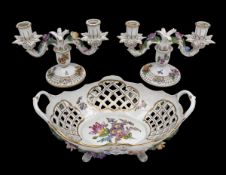 A pair of 20th century Dresden porcelain two branch candlesticks, decorated with applied flowers,