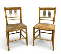 A pair of painted, faux bamboo, Regency side chairs each with spindled splat over the woven rush