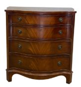 A mid to late 20th century Georgian style bow-fronted chest of four long figured mahogany drawers