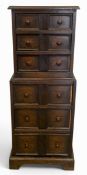 A small vintage oak tallboy chest on chest of six long drawers raised on a shaped plinth base. H.120