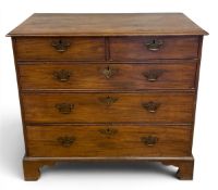 A Georgian mahogany chest of two short over three long graduating drawers raised on shaped bracket