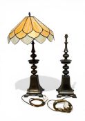 A vintage Tiffany style table lamp with faux leaded composite shade over the bronzed metal stem