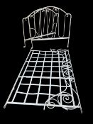 A C.1900 French white painted wrought iron daybed frame with scrolling head, foot and side panels