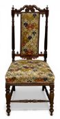 A small 19th century mahogany side chair with carved cresting over the tapestry upholstered splat