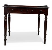A 19th century mahogany writing table or desk with galleried top over two frieze drawers raised on