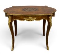 A mid 20thy century French Louis XV style brass mounted walnut and kingwood centre table with