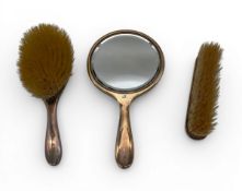 An early 20th century guilloche backed silver dressing table set bearing English hallmarks.