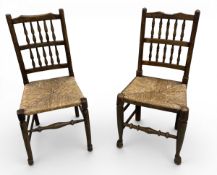 Two 19th century elm Lancashire style dining chairs with spindle backs on rush seat H.96 W.46 D.37cm