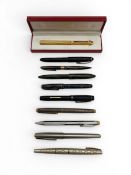 A miscellaneous collection of vintage pens to include a cased Must de Cartier ballpoint pen, a