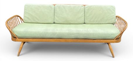 A mid century Ercol Studio Couch, beech and blonde elm, model 355. H.81 W.203 D.77cm (Some wear to