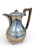 An English hallmarked silver hot water jug, Chester 1934. H.23cm. Weight 731g.