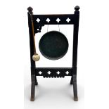 A 19th century oak gong on stand in the Arts and Crafts style. H.94 W.50 D.34cm