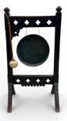 A 19th century oak gong on stand in the Arts and Crafts style. H.94 W.50 D.34cm