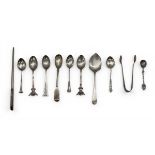 A miscellaneous collection of English hallmarked silver spoons and other items. 124g