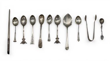A miscellaneous collection of English hallmarked silver spoons and other items. 124g